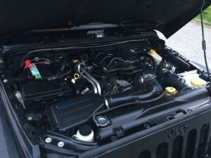 picture showing an engine after we provided car detailing service and engine shampoo